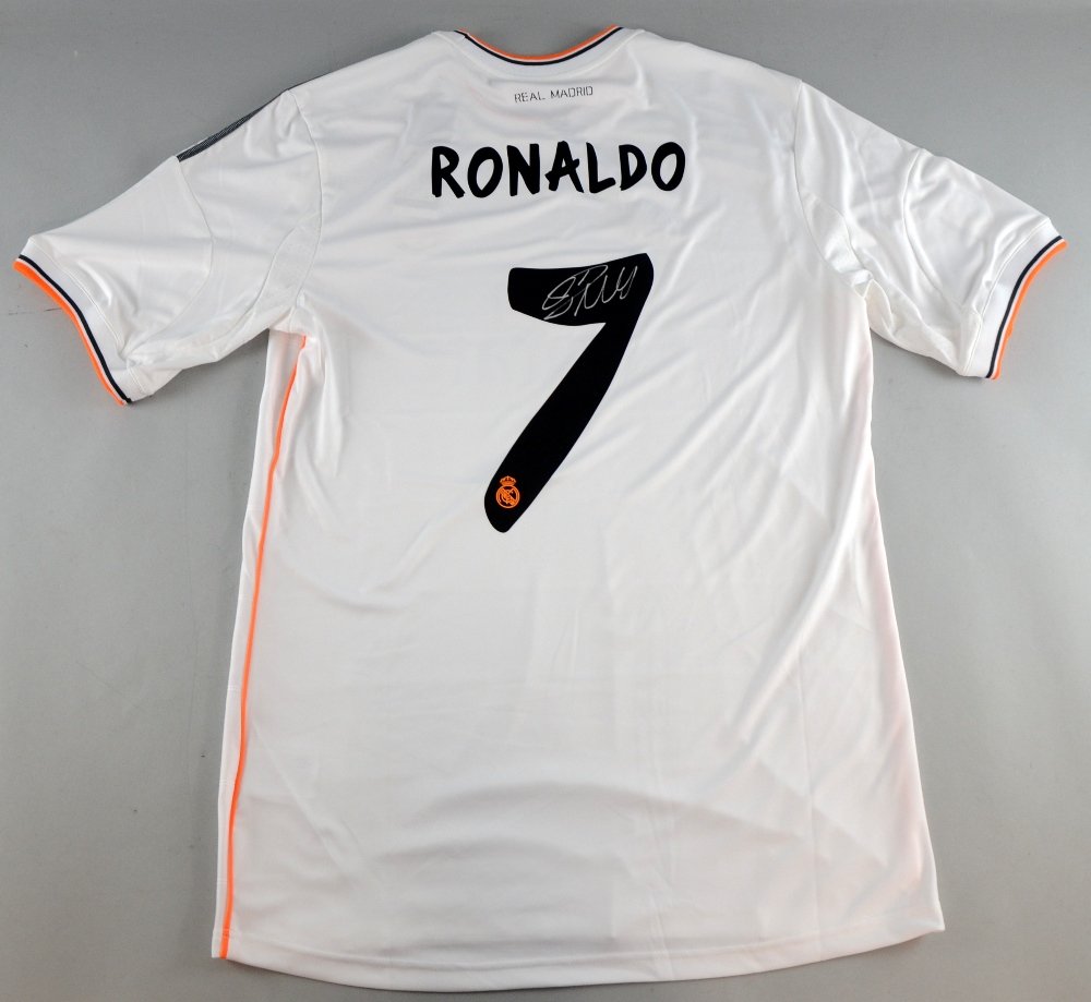 An Official Real Madrid Football Adidas Shirt from 2013: An Official Real Madrid Football Adidas Shirt from 2013 signed to the back by Cristiano Ronaldo size XL, unworn Provenance: Signed during a signing session in Madrid, October 2013.