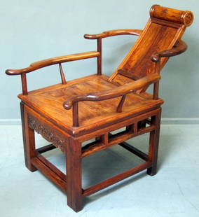 20th century Chinese carved huanghuali chair with: 20th century Chinese carved huanghuali chair with reclining back, and carved with a Shou character, PROVENANCE: Bought by the vendor from the House of Huanghuali, Singapore. 36½in. (91cm)