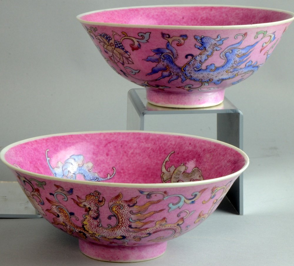 Pair of Chinese pink ground bowls enamelled with: Pair of Chinese pink ground bowls enamelled with dragons, bats and scrolling floral decoration, bearing Kangxi marks, 6.5" diameter,