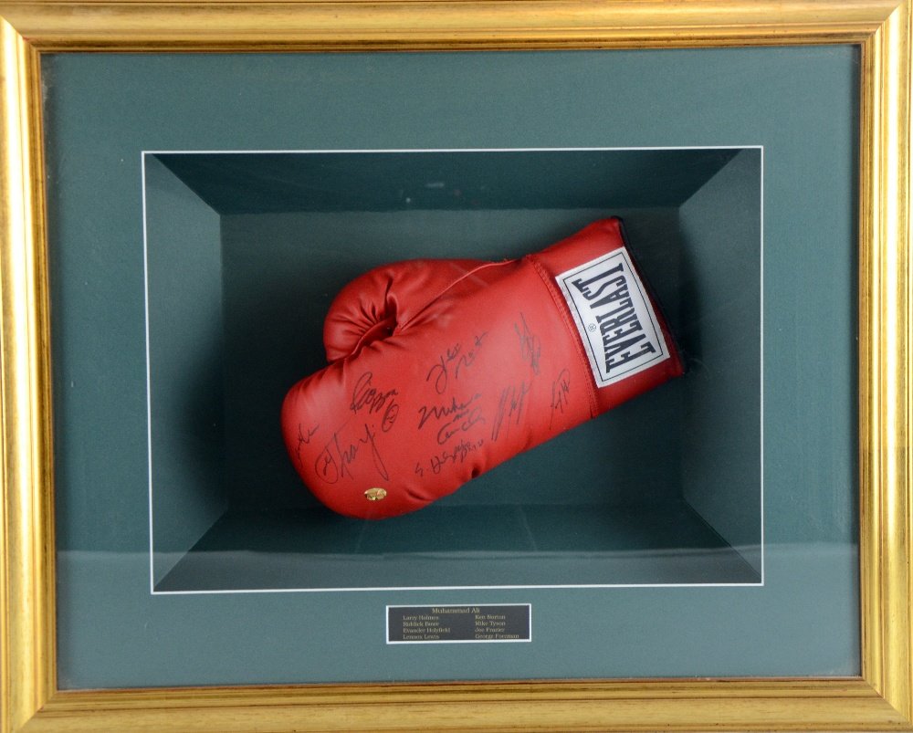 An Everlast Boxing Glove signed by 9 Heavyweight: An Everlast Boxing Glove signed by 9 Heavyweight Champions including Muhammad Ali, George Foreman, Joe Frazier, Mike Tyson, Ken Norton, Lennox Lewis, Evander Holyfield, Riddick Bowe & Larry Holmes, si