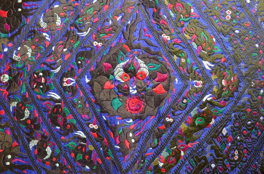Extensively embroidered apron Miao tribe Ghizou: Extensively embroidered apron Miao tribe Ghizou Province China, a Shitou batik print skirt and other items PROVENANCE: From An Important private collection.