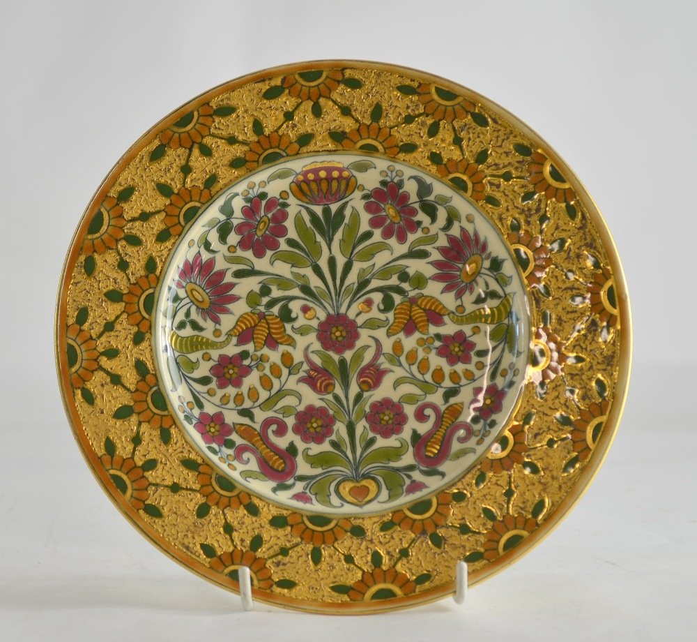 Zsolnay Pecs Persian style plate with formal flower: Zsolnay Pecs Persian style plate with formal flower decoration and gilt highlights stamped and impressed marks, 21.5 cm