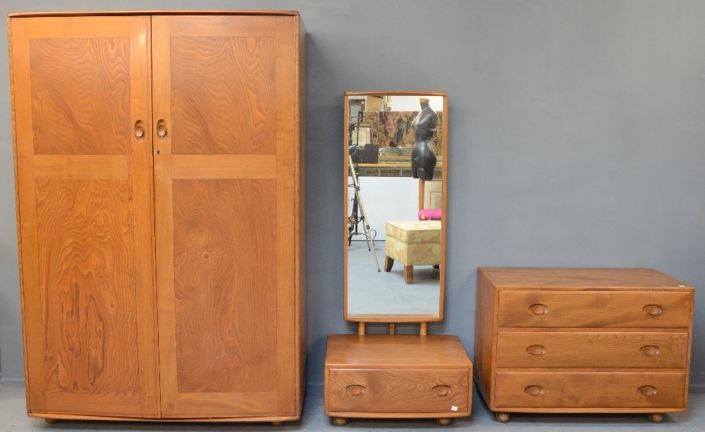 Lucien Ercolani for Ercol , a light elm windsor bedroom: Lucien Ercolani for Ercol , a light elm windsor bedroom suite , comprising a wardrobe with interior chest A chest of drawes and a low dressing table . Designed mid 20th C .