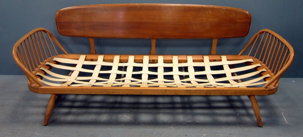 Ercol mid 20th C elm and beech settee with stick and: Ercol mid 20th C elm and beech settee with stick and board back, 213 cm