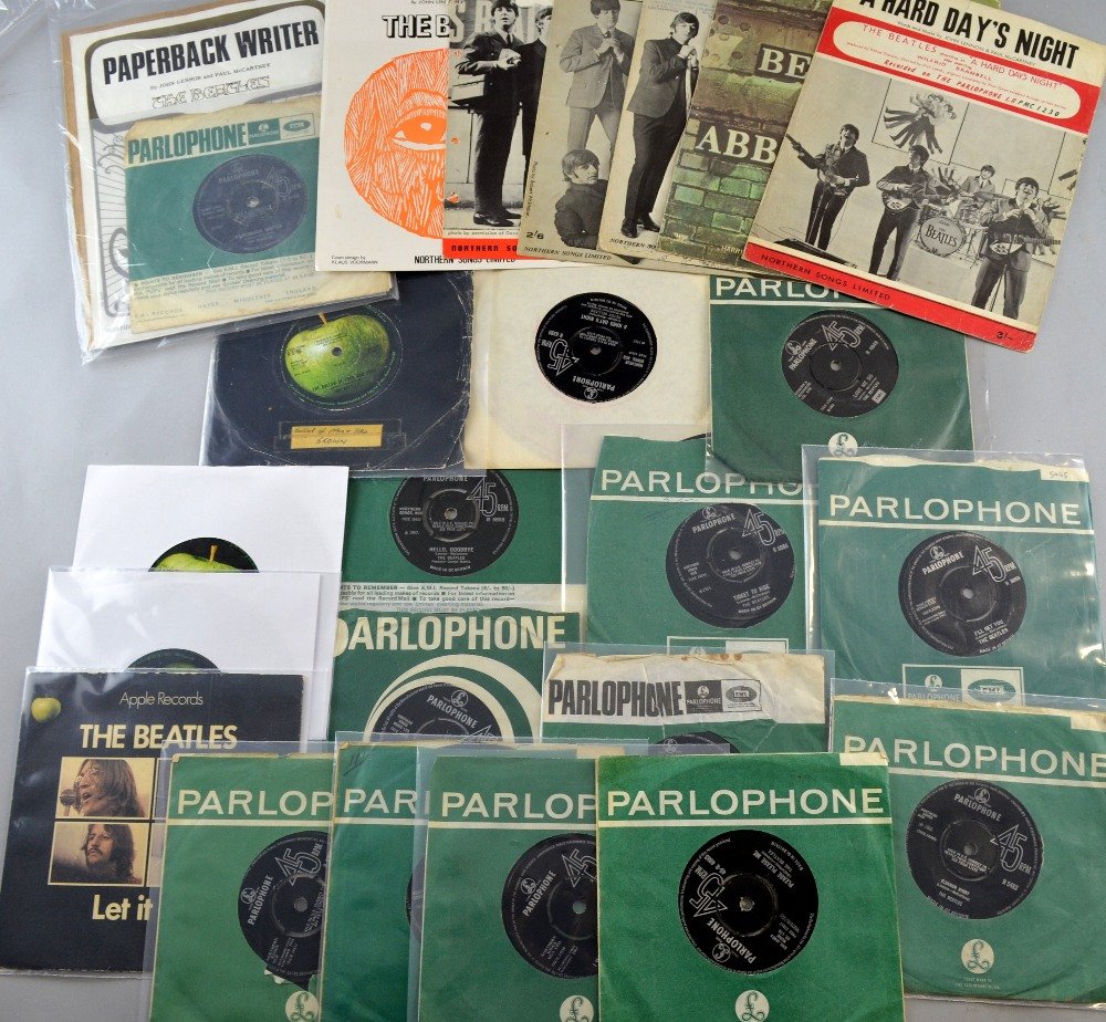 The Beatles, Sixteen Parlophone and Apple UK vinyl: The Beatles, Sixteen Parlophone and Apple UK vinyl 45RPM records including A Hard Day's Night, Please Please Me, She Loves You, Love Me Do, Hey Jude, Yellow Submarine & others along with seven origina