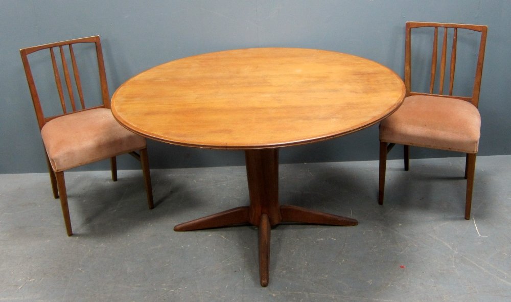 Ercol circular dining table and set of six matching: Ercol circular dining table and set of six matching dining chairs with pink upholstered seats 74cm high x 128cm diameter