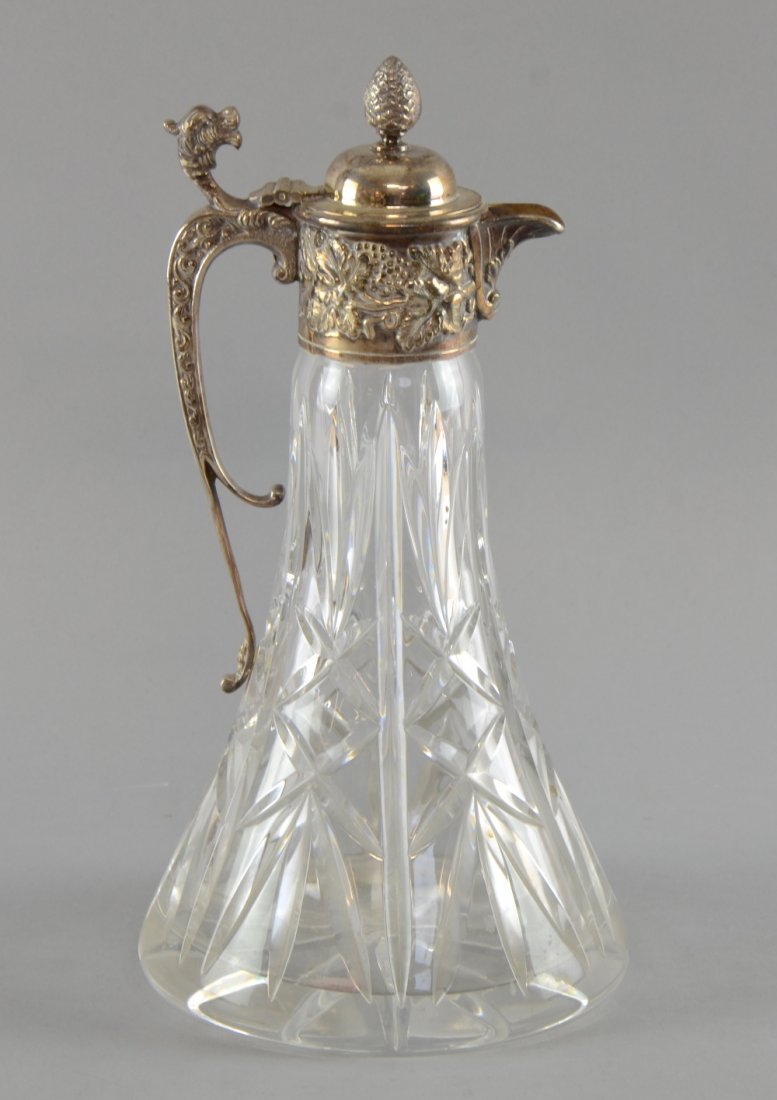 Mappin & Webb cut glass claret jug with silver plated: Mappin & Webb cut glass claret jug with silver plated mounts, with scrolling dragon's head handle, 27cm high,