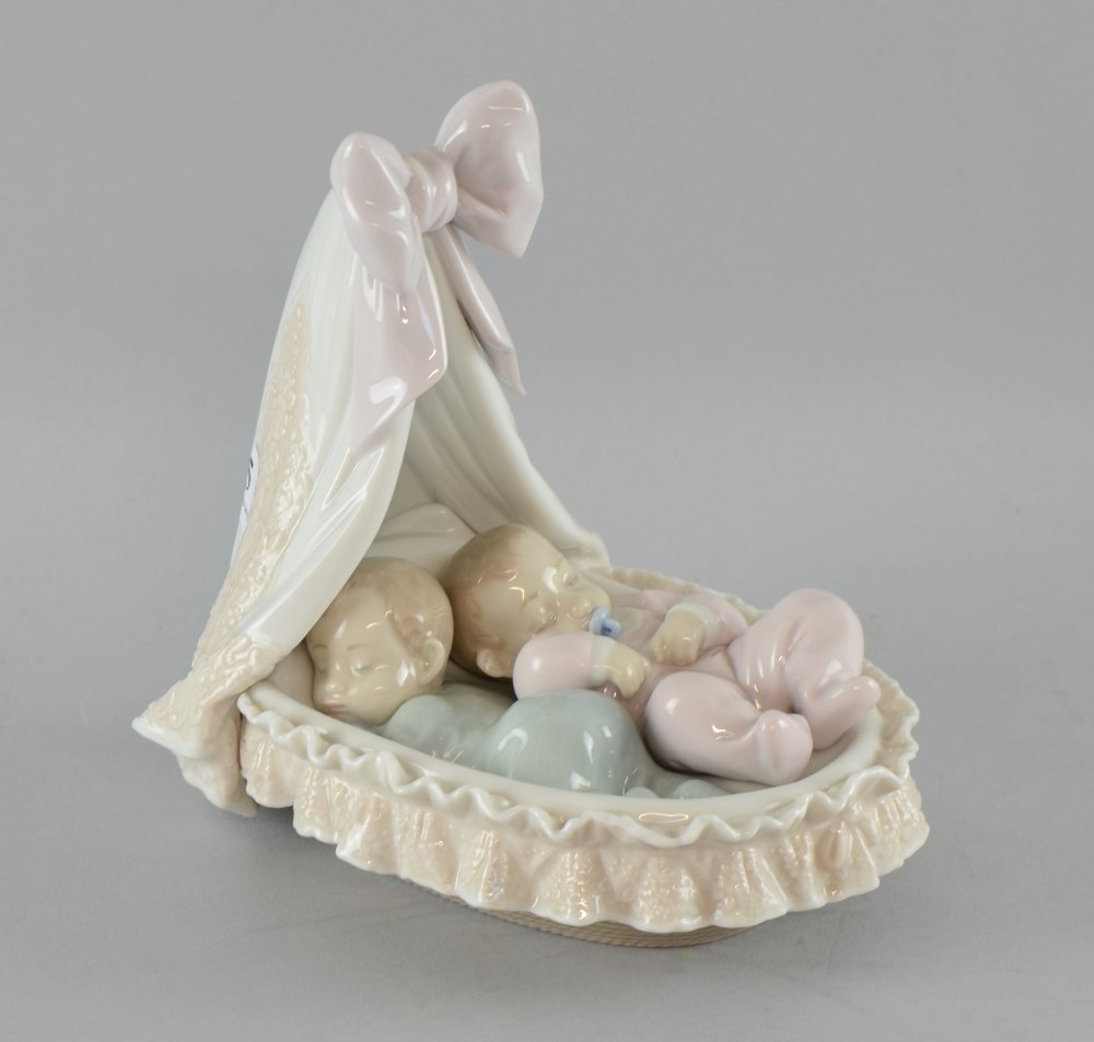 Lladro figure of two babies in a cot, 19cm Provenance:: Lladro figure of two babies in a cot, 19cm Provenance: Deceased estate - part of a large single owner collection of LLadro comprising over 200 pieces sold in over 100 lots, collected in the 1980s and 
