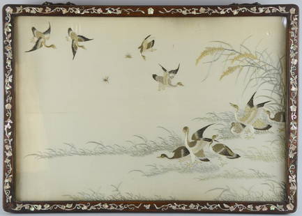 Chinese silkwork picture depicting geese in flight and: Chinese silkwork picture depicting geese in flight and amongst foliage, in rosewood and mother of pearl inlaid frame, 41cm x 60cm, Frame damaged. Some mother of pearl missing. Some staining and discol