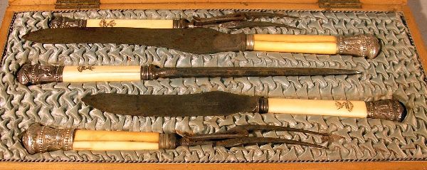 Cased carving set with two carving knives: Cased carving set with two carving knives two forks and a steel, silver terminals