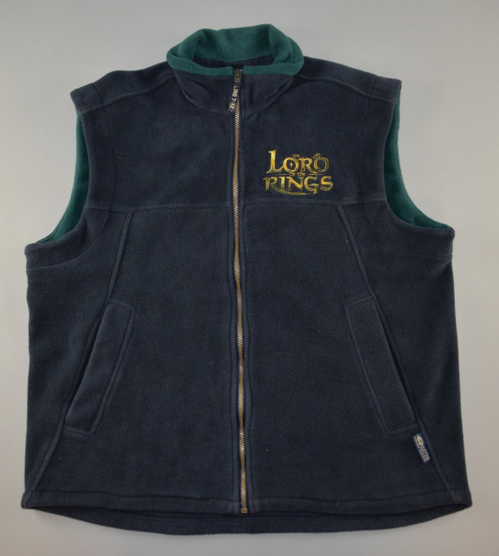 The Lord of the Rings - A movie production, gilet owned: The Lord of the Rings - A movie production, gilet owned & worn at a fan event celebrating the middle day of filming 'Day 133' May 23, 2000, by Sir Christopher Lee, made by Line 7, size XXL.Provenance: