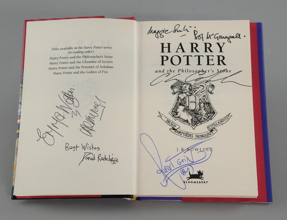 Harry Potter and the Philosopher's Stone - Hardback: Harry Potter and the Philosopher's Stone - Hardback book signed to the inside by Daniel Radcliffe, Emma Watson, Rupert Grint, Maggie Smith & Chris Columbus.Provenance: Consigned by Peter Harvey who wo