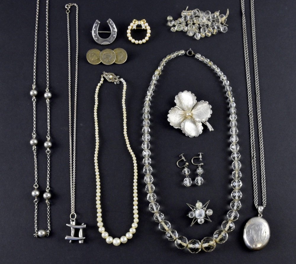Collection of silver, including two neck: Collection of silver, including two necklaces, locket, brooches, paste brooches and imitation pearl necklace and a coin brooch, Crystal necklace and earrings