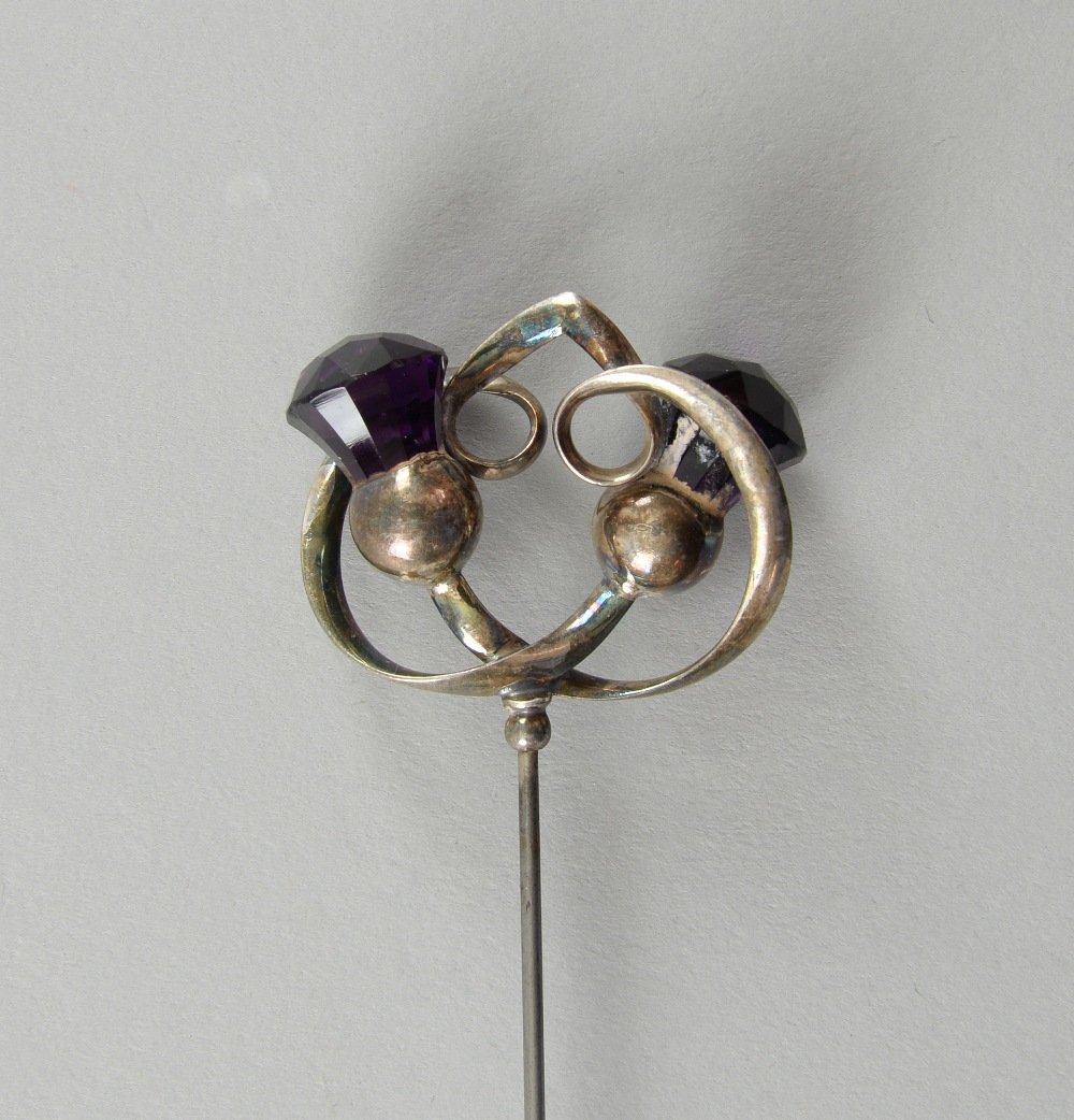 Charles Horner hat pin of thistle form set with two: Charles Horner hat pin of thistle form set with two amethyst coloured stones Chester 1923