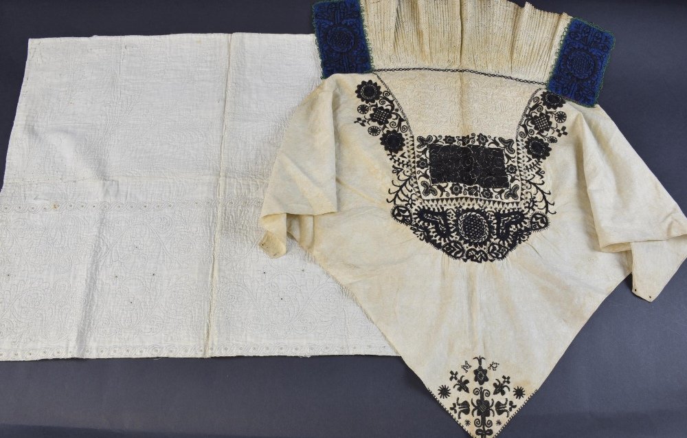 Queen Anne period quilted fragment, quilting in the: Queen Anne period quilted fragment, quilting in the form of large leaves in running stitch, a line of scrolls and flowers all with button hole stitched centres, possibly once part of a bodice, and hea