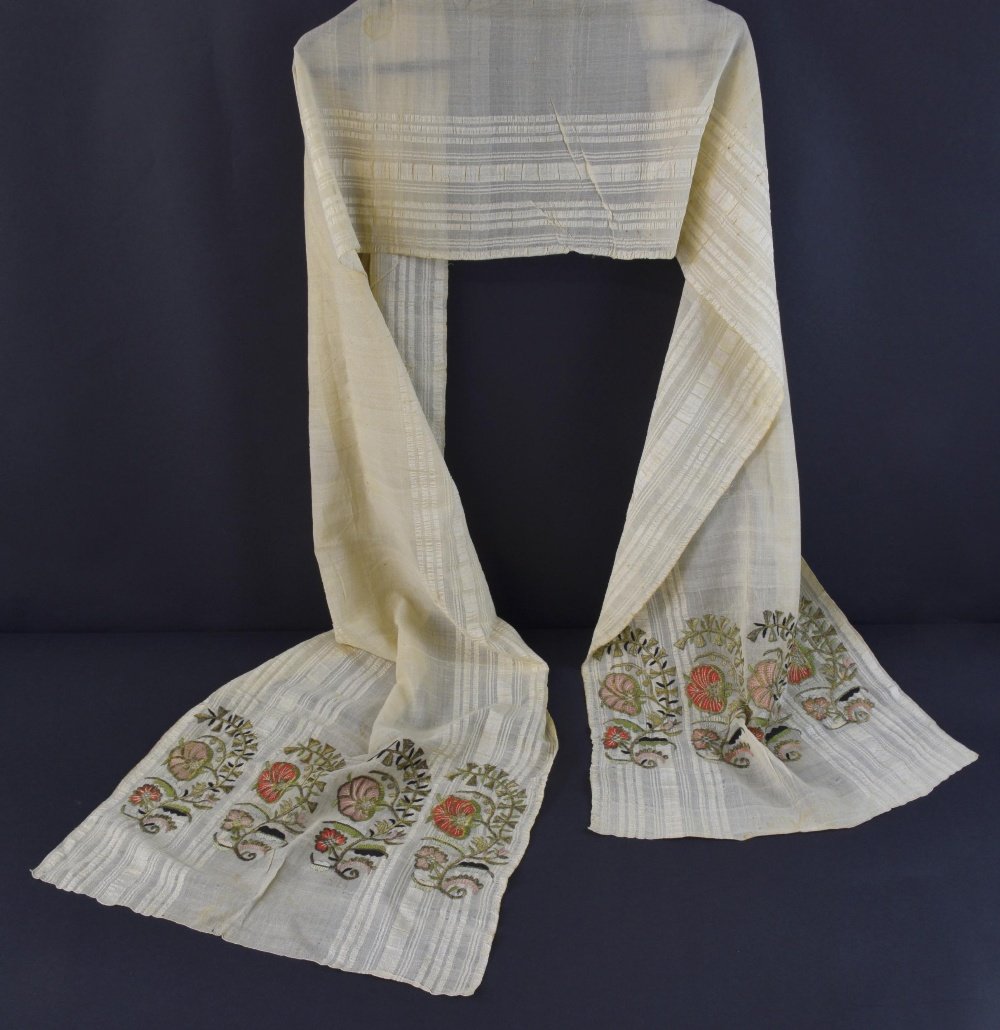 19th C Armenian embroidered towel, each end with repeat: 19th C Armenian embroidered towel, each end with repeat pattern of orange and peach coloured flowers worked in silk stitch.Provenance: An important collection of International Historical textiles.