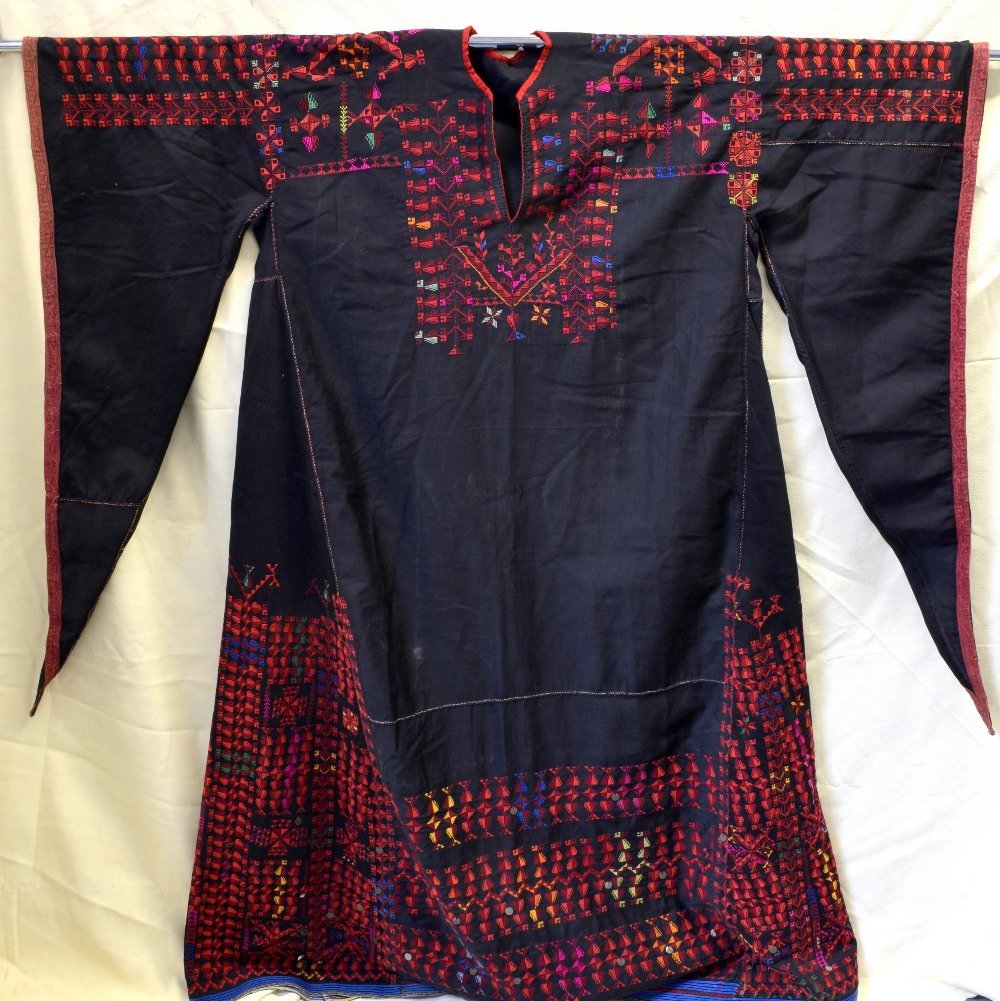 Bedouin thobe extensively embroidered in cross stitch, (1 of 4)