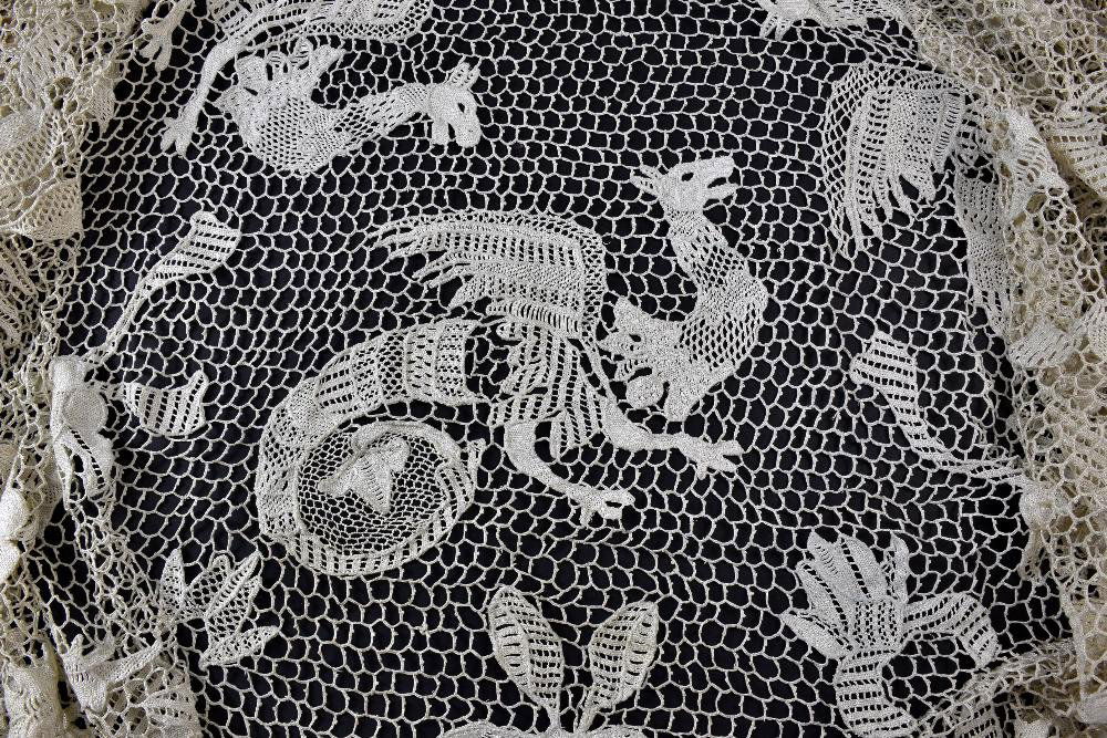 Circular crocheted table cloth with large scale flowers (1 of 5)