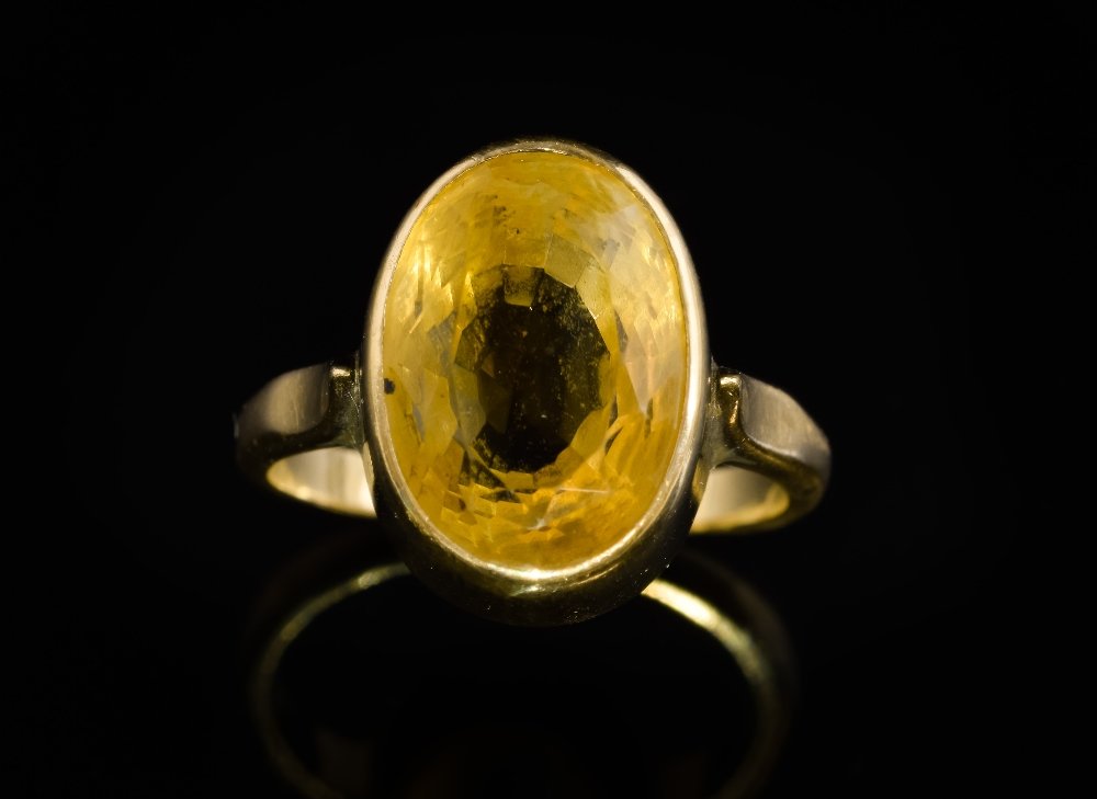 Citrine and gold dress ring, in yellow metal tested as (1 of 2)
