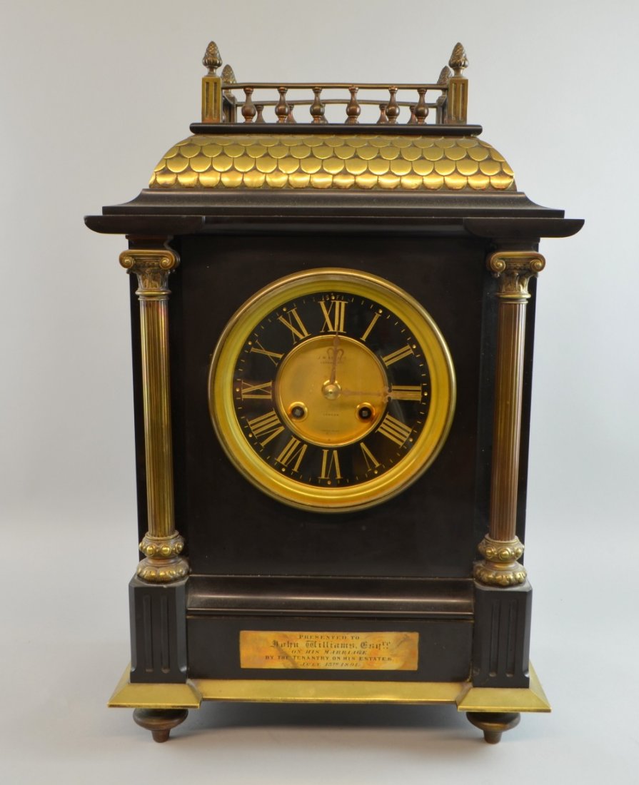 19th century J W Benson of London polished slate and: 19th century J W Benson of London polished slate and brass mantel clock with a twin train striking on a chime, 57cm plaque reading 'Presented John Williams Esq. on his Marriage by his Tenantry on his
