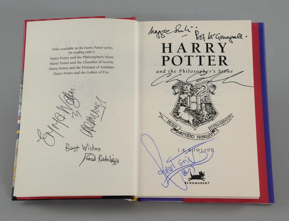 Harry Potter and the Philosopher's Stone - Hardback: Harry Potter and the Philosopher's Stone - Hardback book signed to the inside by Daniel Radcliffe, Emma Watson, Rupert Grint, Maggie Smith & Chris Columbus.Provenance: Consigned by Peter Harvey who wo
