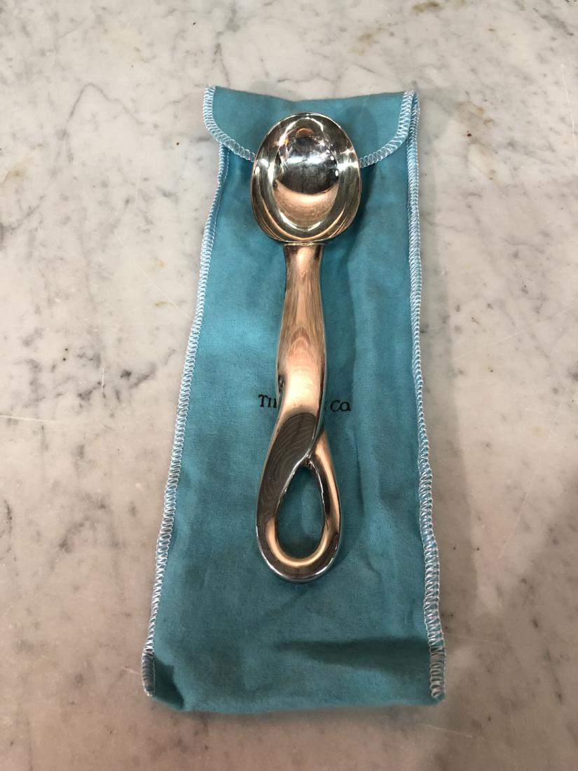 Tiffany & Co. "Elsa Peretti" Ice Cream Scoop Sterling: 7 1/4" long Sterling Ice Cream Scoop with felt Bag, marked "Tiffany & Co. .925 Italy", wear appropriate for age