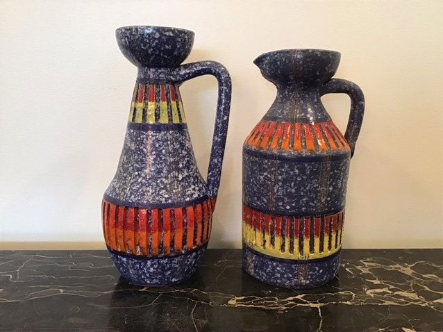 Raymor Italian Water Pitchers: A pair of Raymor water pitchers. Marked Made in Italy. Very good overall. Vibrant colors. 10” & 9 1/4” tall each.