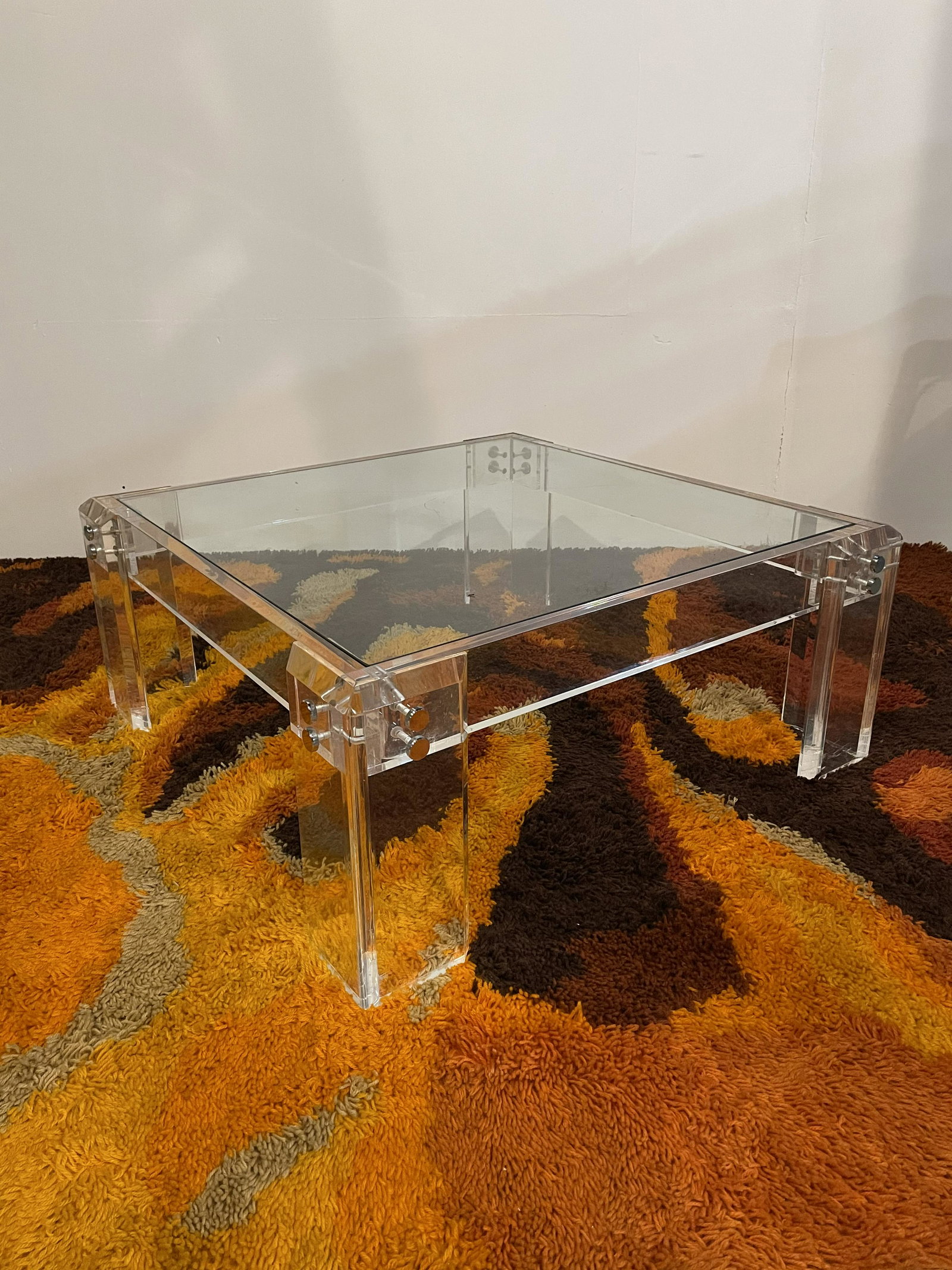 In the manner of Milo Baughman Lucite Coffee Table: 15in T x 34in x 34in base