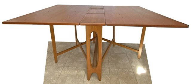 Mid Century Danish Folding Gate Leg Table: Unmarked in the manner of Bendt Winge for Kleppes Møbelfabrikk Measurements: H: 28" W" 39" L: (fully extended) 108"Condition: there are two linear stains in the finish on the top. There are general s