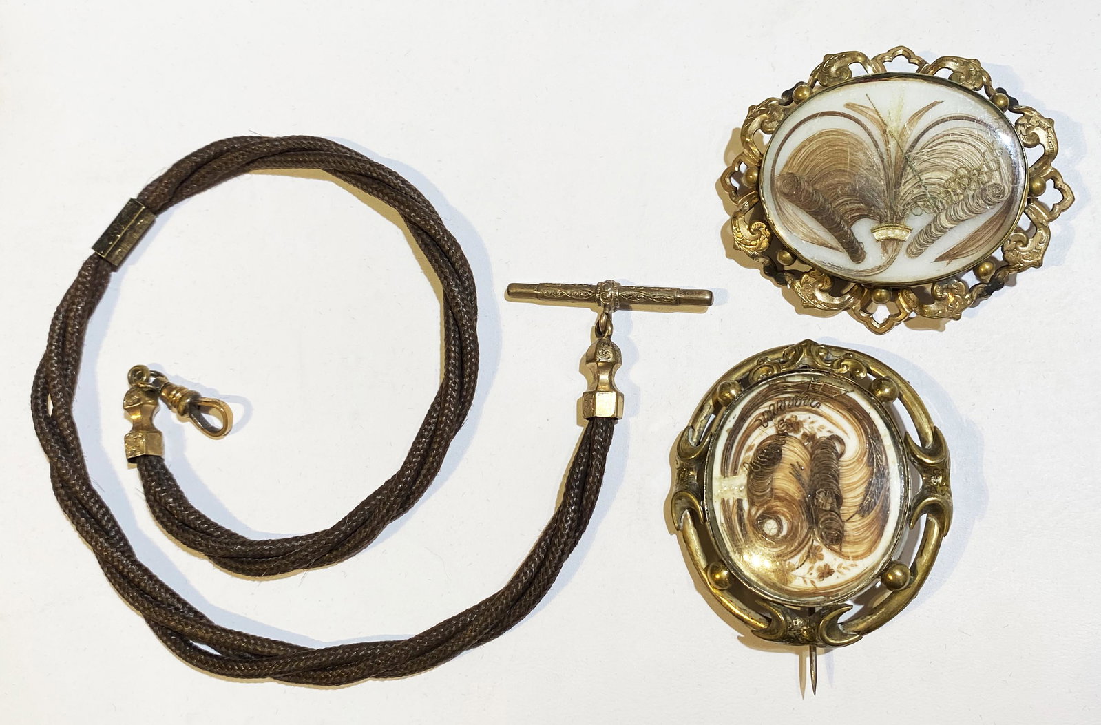 Collection 19th C Victorian Hair Jewelry: 2 Brooches and watch chain