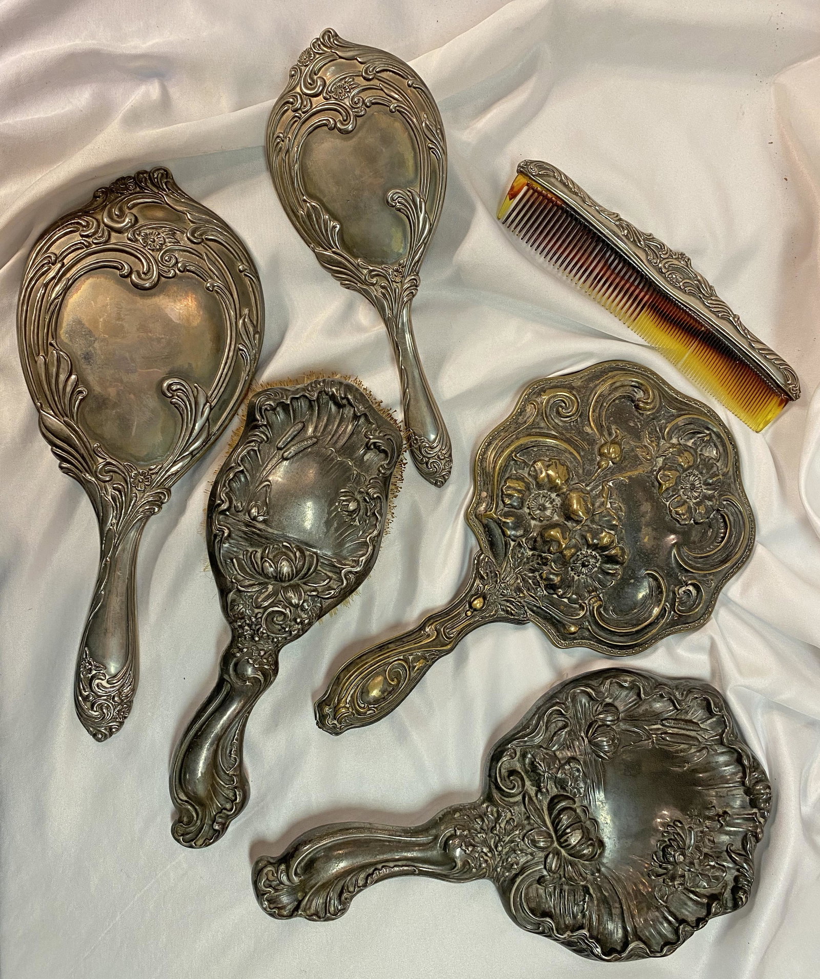 Collection of Art Nouveau Silver Hand Mirrors: deep relief on most one is brass