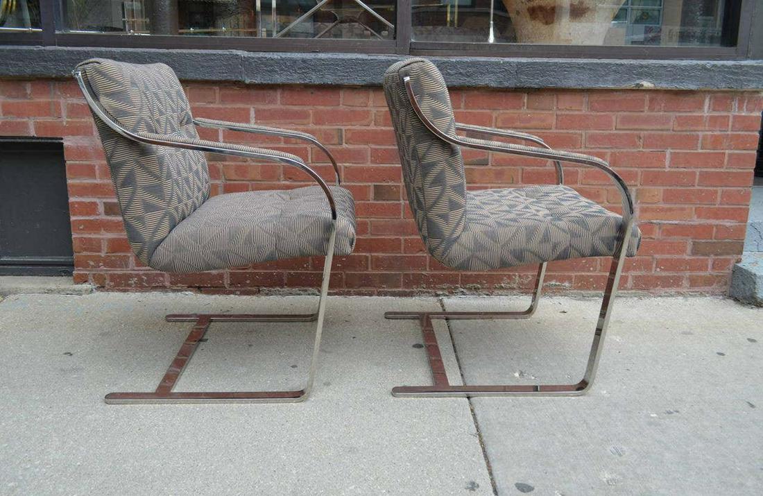 Chrome Dining Chairs By Brueton Set of 8: Set of EIGHT (picture shows 12) finely crafted polished stainless steel and chrome dining chairs by Brueton. The chairs are cantilevered with elegant lines in the manner of Knoll's Brno chair. Upholst