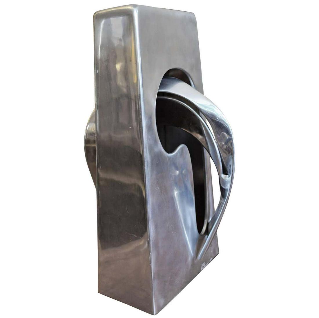 Abstract Aluminum Sculpture by Bill Keating: A signed Bill Keating 1979 organic polished aluminum Mid-Century sculpture.Keating is a self taught Chicago artist. His specialty is hand formed weldedaluminum objects. Bill's work figures prominently