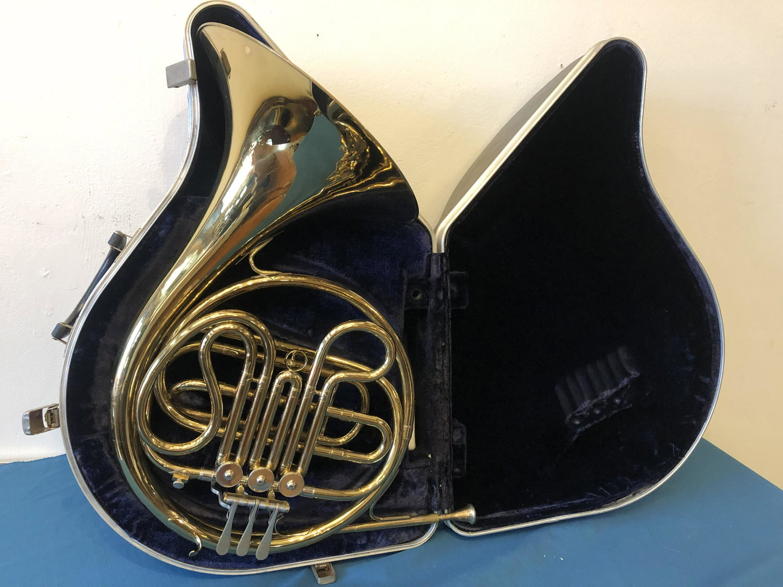 Conn French Horn in case: about 17 by 22 in Conn