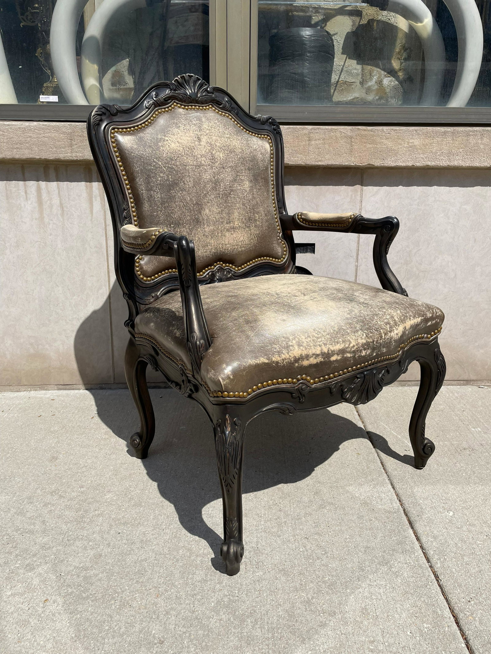 Brass Nail head Trim and Leather Armchair: 41in H to the back x 18in H to the seat x 26in W x 26in D