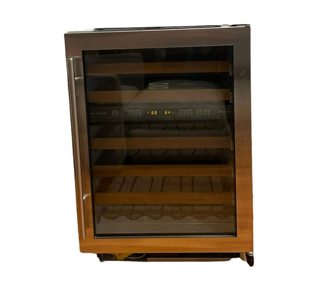 SUBZERO Wine Refrigerator: 35in H x 24in L x 24in D. Meant to be put under a counter, side and top is unfinished.