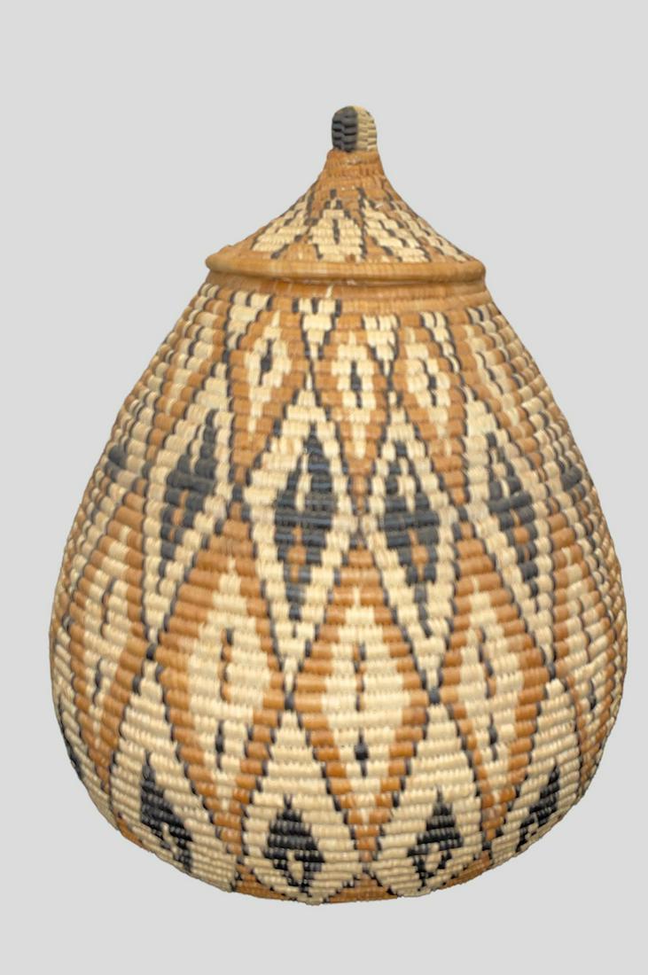 Mid Century African Zulu Basket: 8.5in L x 12in H