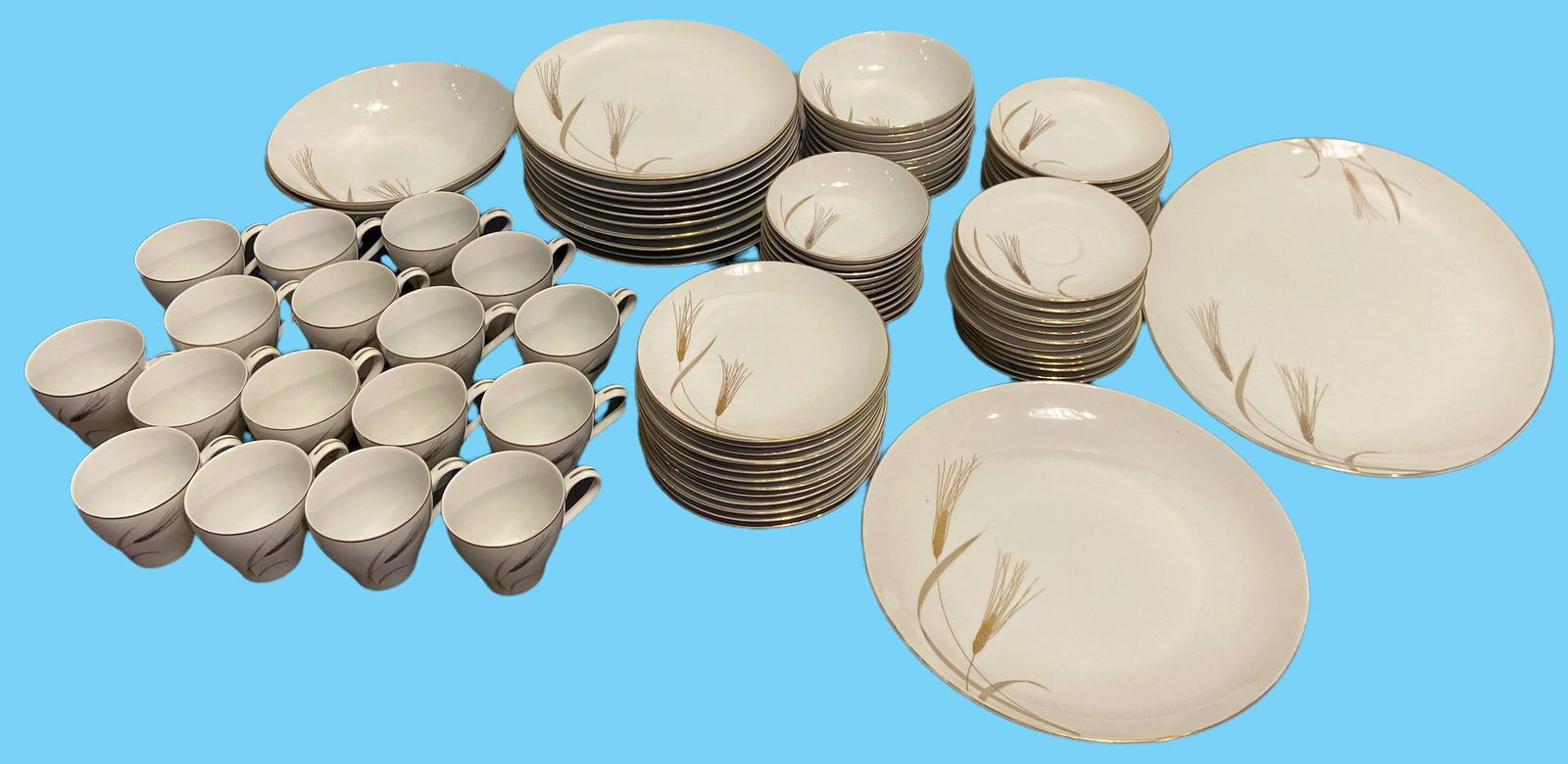 Mid Century MIKASA Golden Harvest Dinnerware Set: 17 cups, 12 small saucers, 11 side bowls, 12 small plates, 10 soup bowls, 12 medium plates, 11 large plates, 2 large bowls, 1 serving plate, 1 serving platter. This will be quite expensive to ship but
