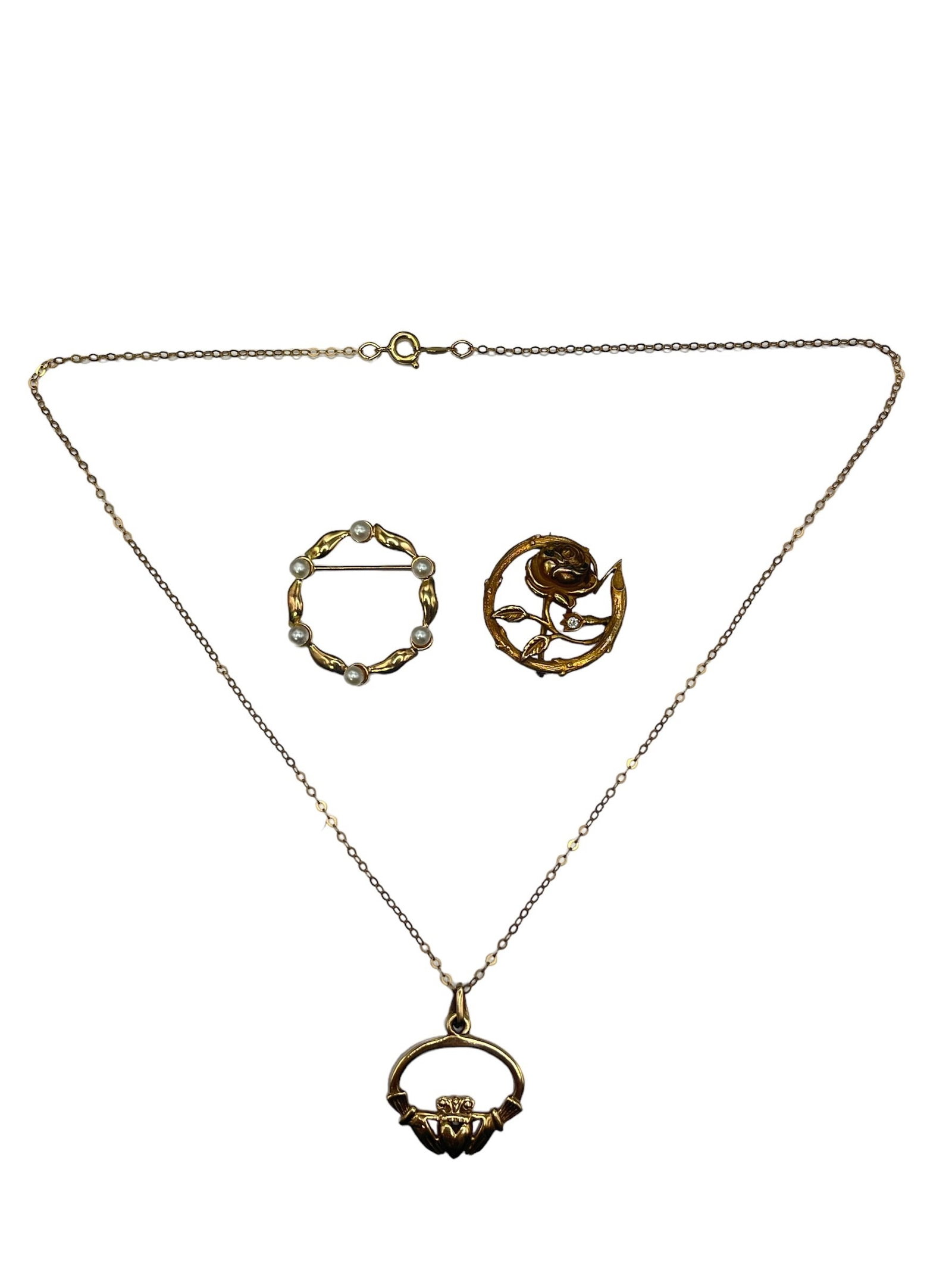 Vintage 14k Gold, Pearl, Diamond Brooches, Claddagh Necklace: Includes a 14k gold and pearl brooch, 14k gold and diamond brooch, and a 14k gold claddagh pendant on a gold filled chain. Brooches and pendant weigh .27oz . The chain is 16" total length.