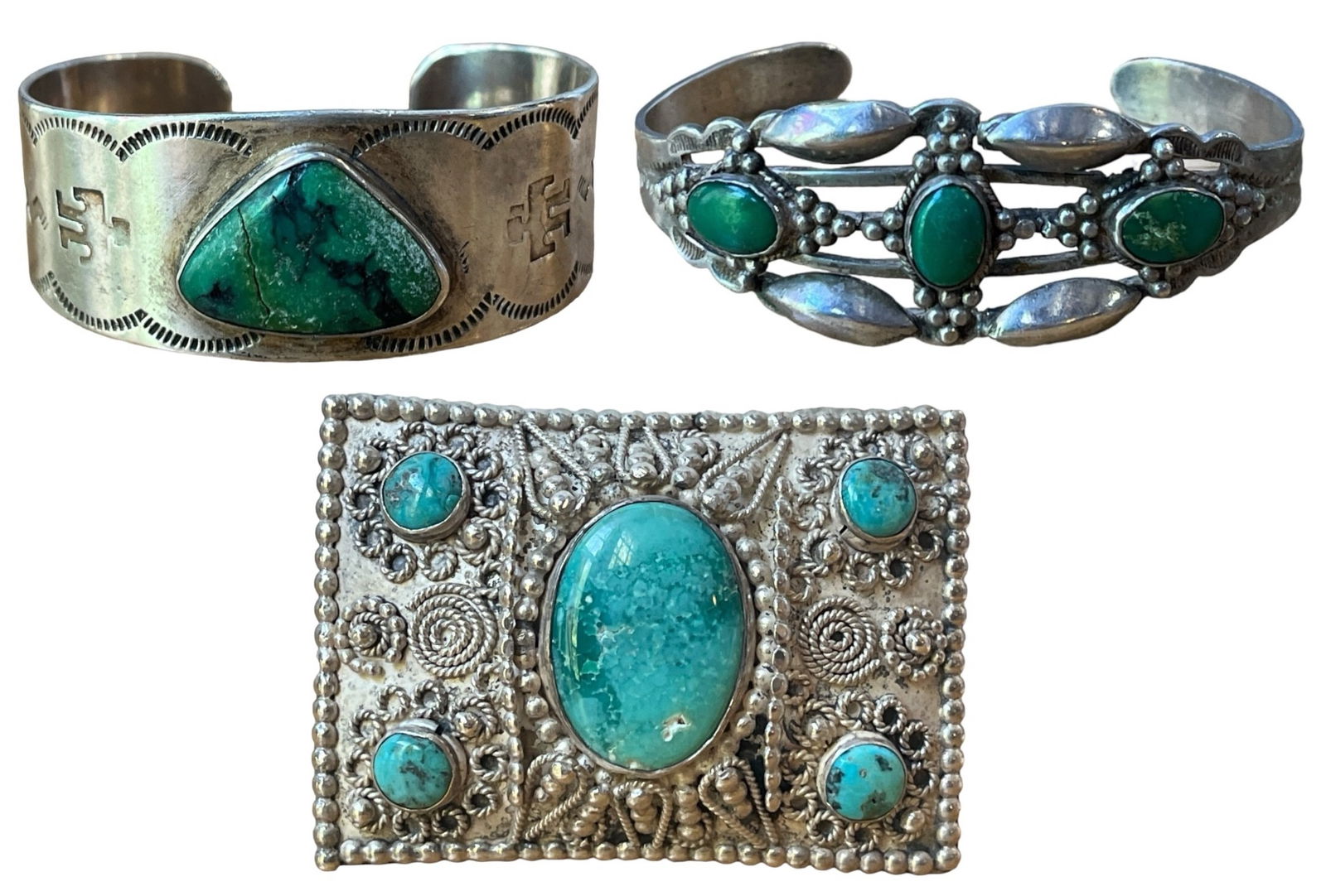 Southwestern Sterling Silver and Turquoise Cuff Bracelets & Brooch Pendant: Brooch measures 2.75" H x 2" W; Both bracelets measures approx. 2.5" x 2". Lot weighs 3.85ozt.