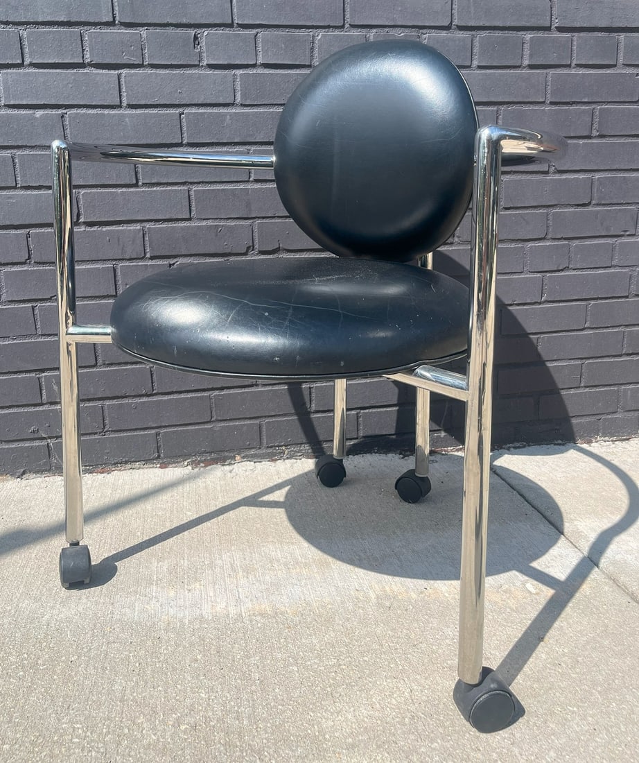 BRUETON Leather and Chrome Chair: 32" H to the back, 17" H to the seat x 26" W x 24.5" D.
