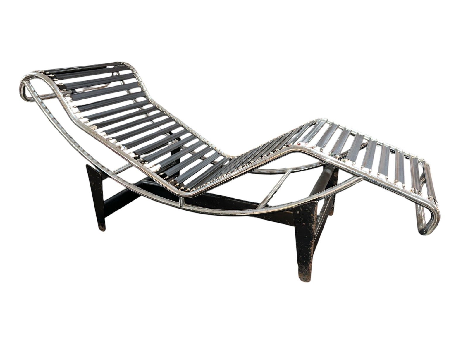 LE CORBUSIER LC4 Chaise Lounge: CHARLOTTE PERRIAND, PIERRE JEANNERET & LE CORBUSIER LC4 Chaise Lounge. Circa 1970s-80s. 27" H x 65" L x 22" W. Manufacturer's mark on underside of chrome frame, no. 1927.