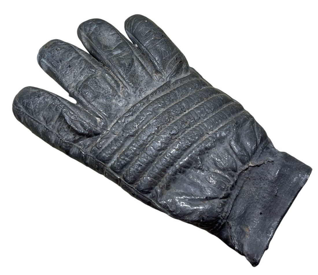 Glove Sculpture, Metal: 8.5" H x 5" W x 1" D.