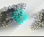 A 14k White Gold Diamond and Emerald Ring