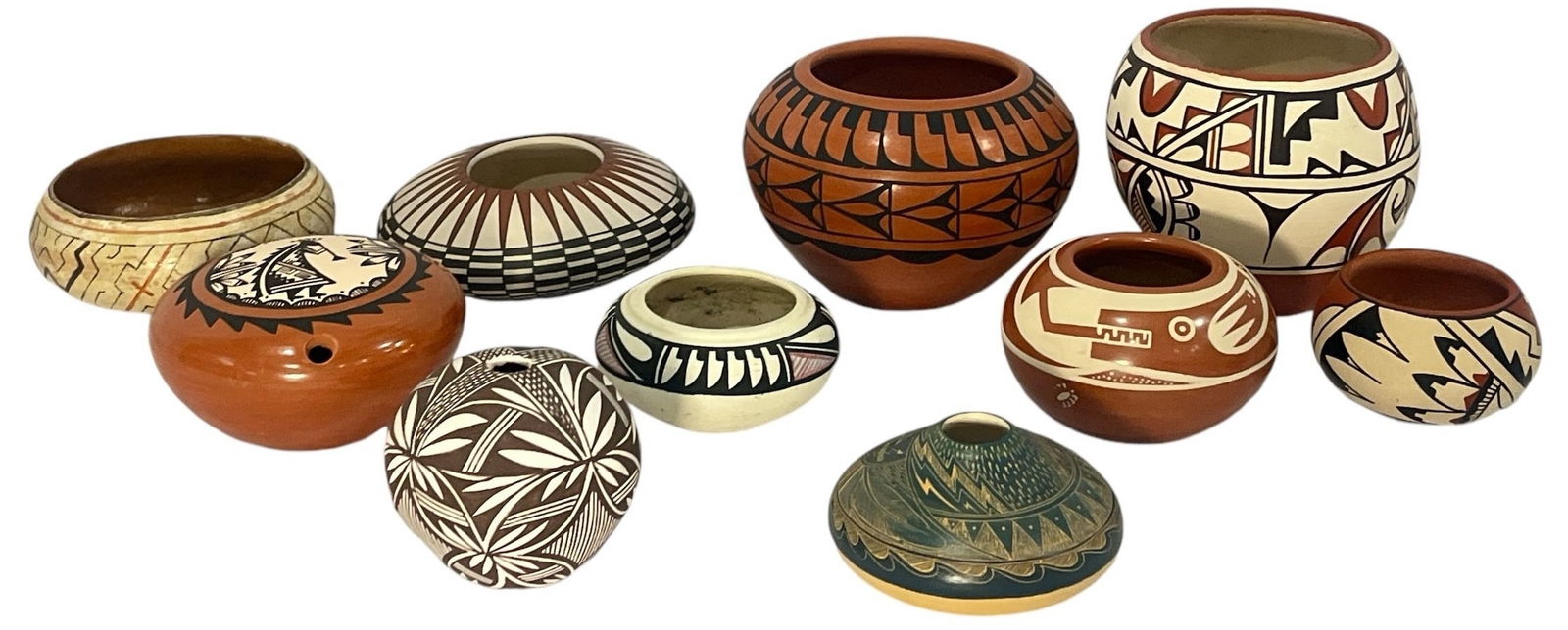 Large Collection of Native American Polychrome, Redware Pots: Largest pot is 5" H x 5" DIA. Includes an assortment of artists and origin location. Some pots are signed by the artists- please see photos.