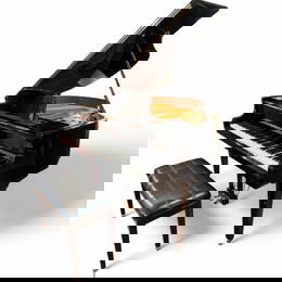 A WURLITZER Baby Grand Piano