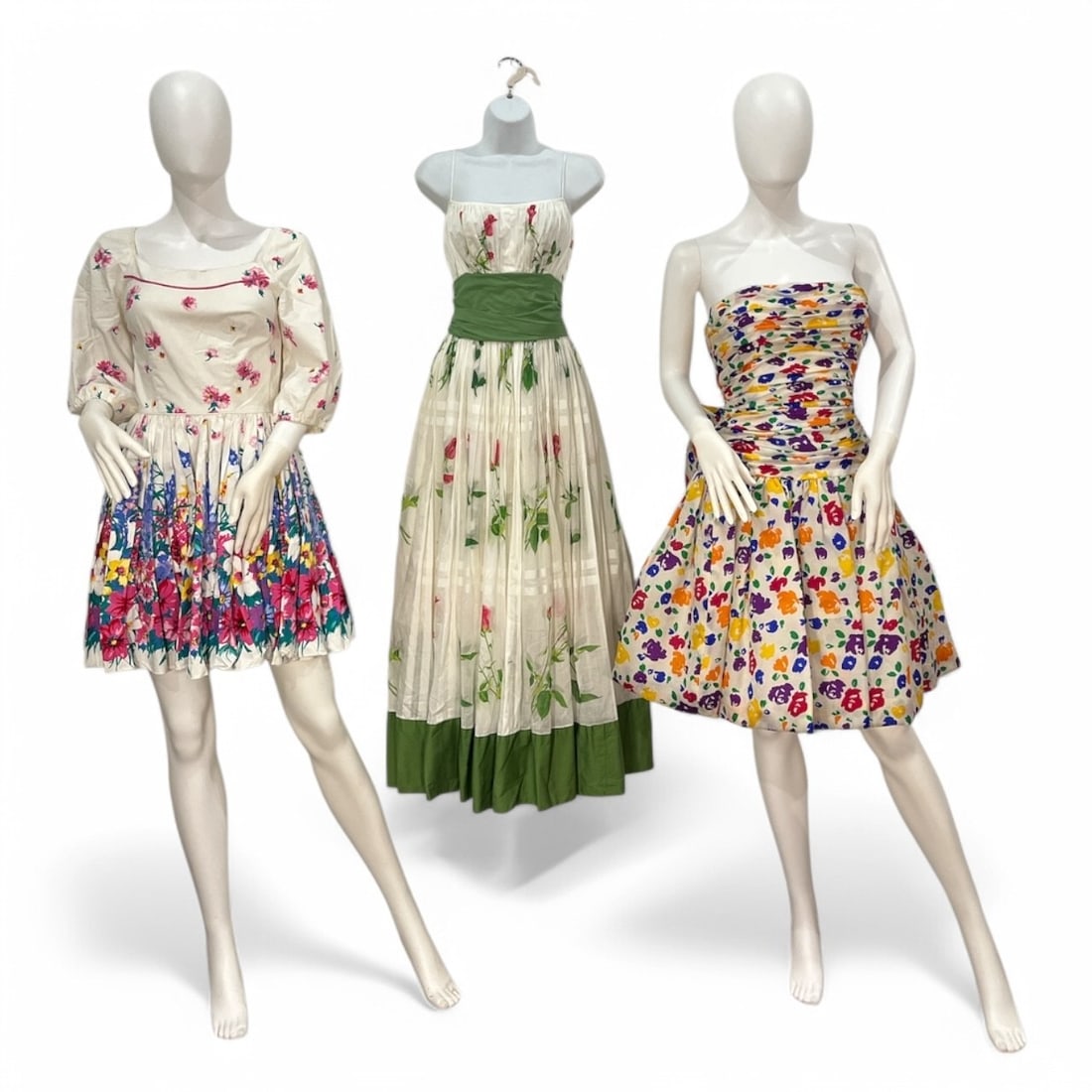 Three 1970s-1980s Floral Day Dresses: The Julie Deroche bow back dress is 36" bust, 26" at the waist, 28" total length, the long white and green Pat Premo dress has a total length of 54", 22" bust, 20" at the waist, the Ruffles & Frills b