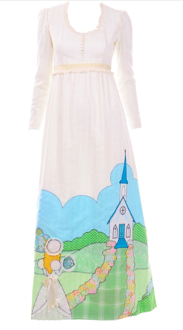 A 1974 Victorian Era Inspired Quilted Bridal Dress: Total length of 56", 36" bust, 26" at the waist, sleeve length of 23". A handmade piece with a tag on the inside that reads: "Spring Bride" Appli-tique March 1974 Joyce Whitcomb-Black.