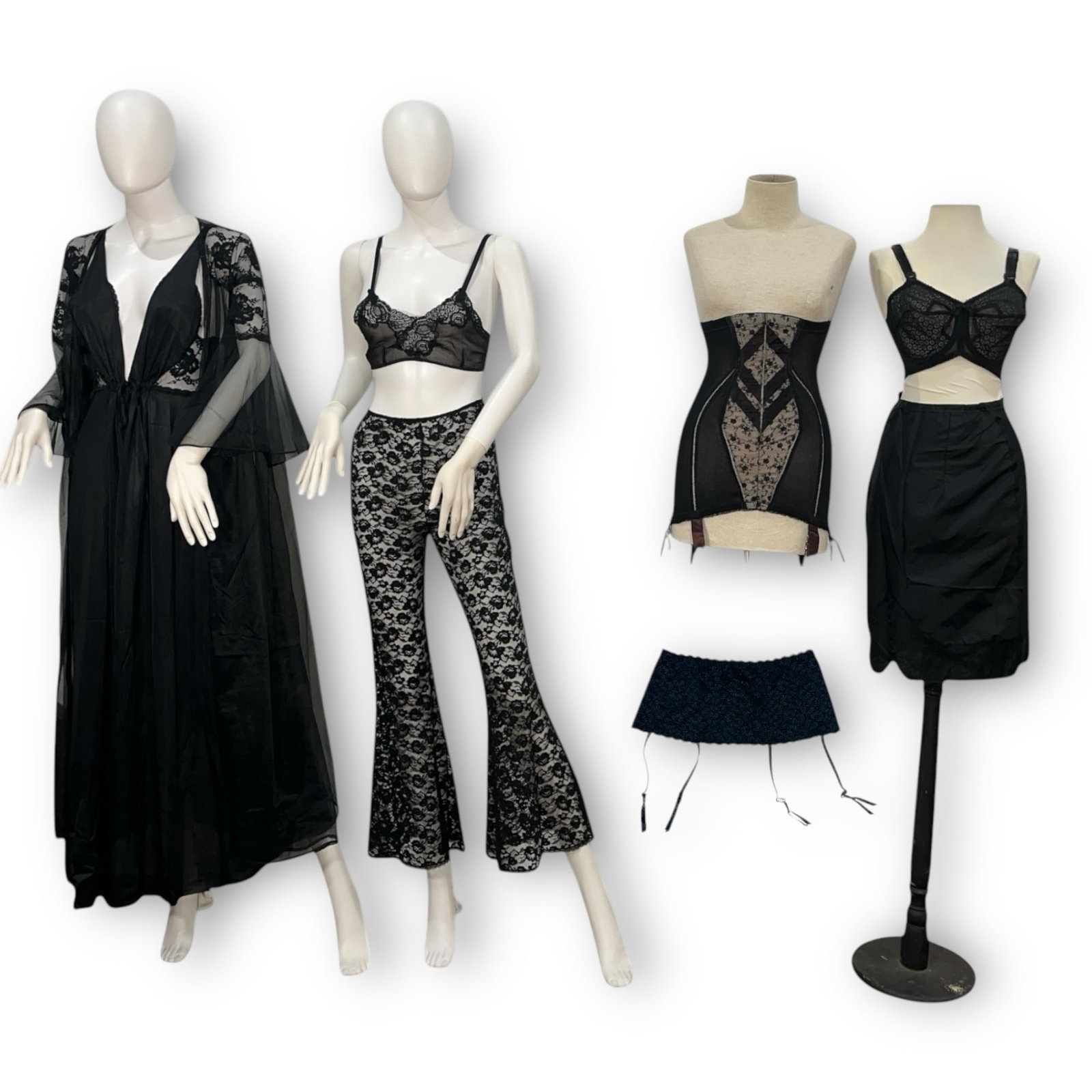 A Collection of Vintage Womens Black Lingerie & Sleepwear: This lot includes an assortment of pieces including bras, a half slip, a lace girdle, a nightgown, a robe and more. Please see photos for all included pieces.