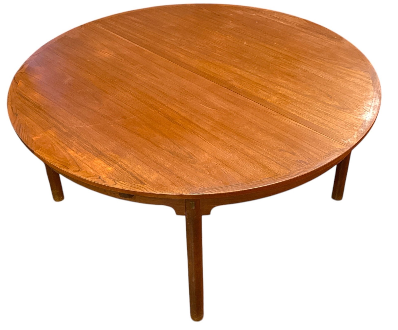 BORGE MOGENSEN "Oresund" Dining Table for KARL ANDERSSON & SONER: Teak & Brass. Retains Illums Bolighus Kobenhavn manufacturers label to underside. Circa 1959. Comes with two leaves. 28.5" H x 60" diameter. 103" L with both leaves.